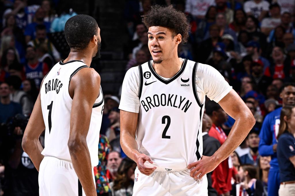 Cameron Johnson speaks with Mikal Bridges during Game 2 of Nets-76ers.