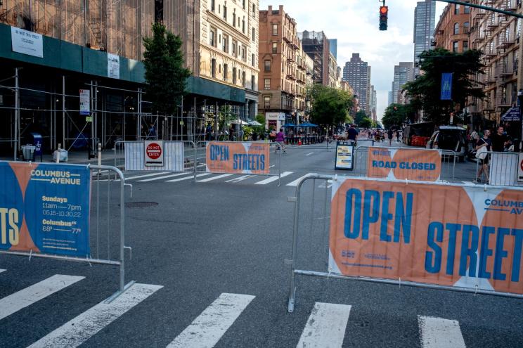 "Road closed, Open streets" signs are displayed to close the road on the Upper West Side.