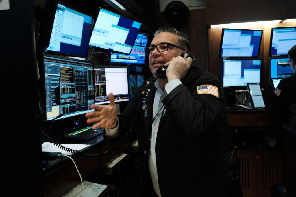 Traders work on the floor of the New York Stock Exchange (NYSE) on March 28, 2023 .