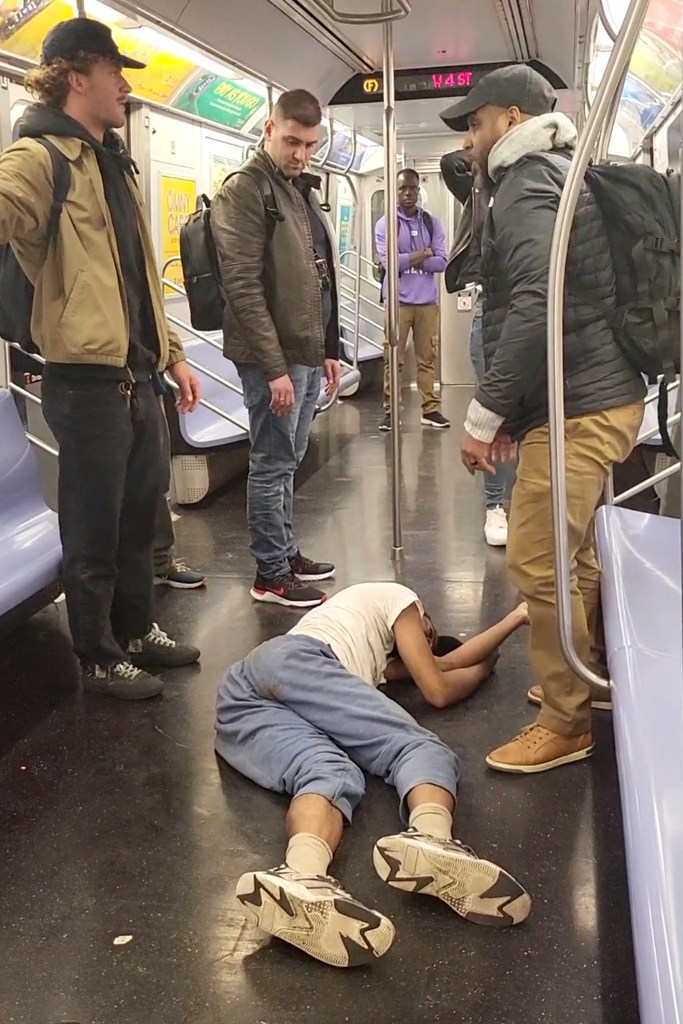 Neely on the subway floor after the confrontation. 