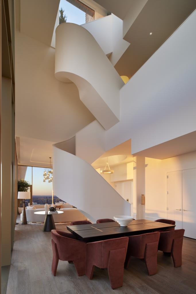 The dramatic curving staircase of the East 88th Street home that served as Kendall Roy's place on "Succession"