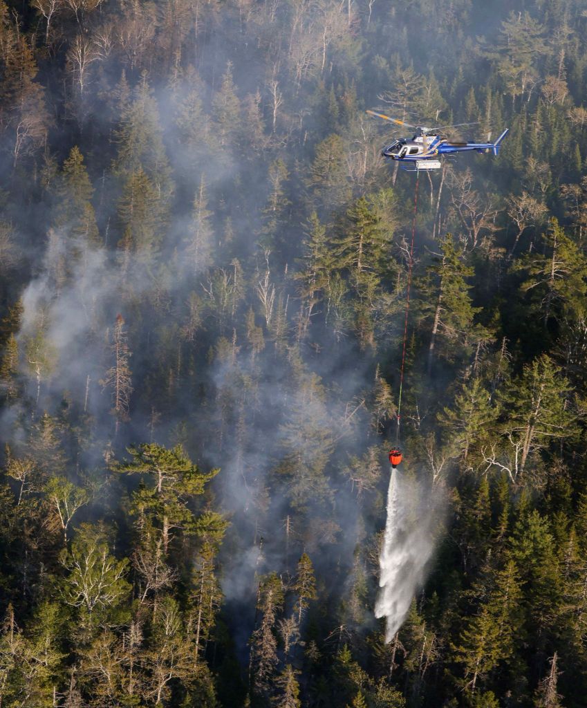 A helicopter drops water on the Tantallon wildfire, west of Halifax.