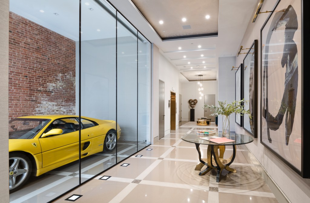 Foyer with glass-walled car gallery at 357 West 17th Street in Manhattan