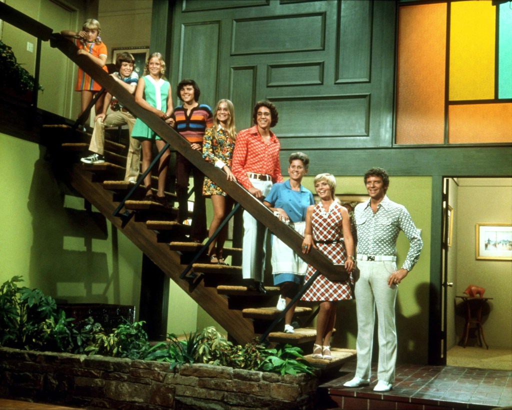 Cast of "The Brady Bunch" lined up on the stairs