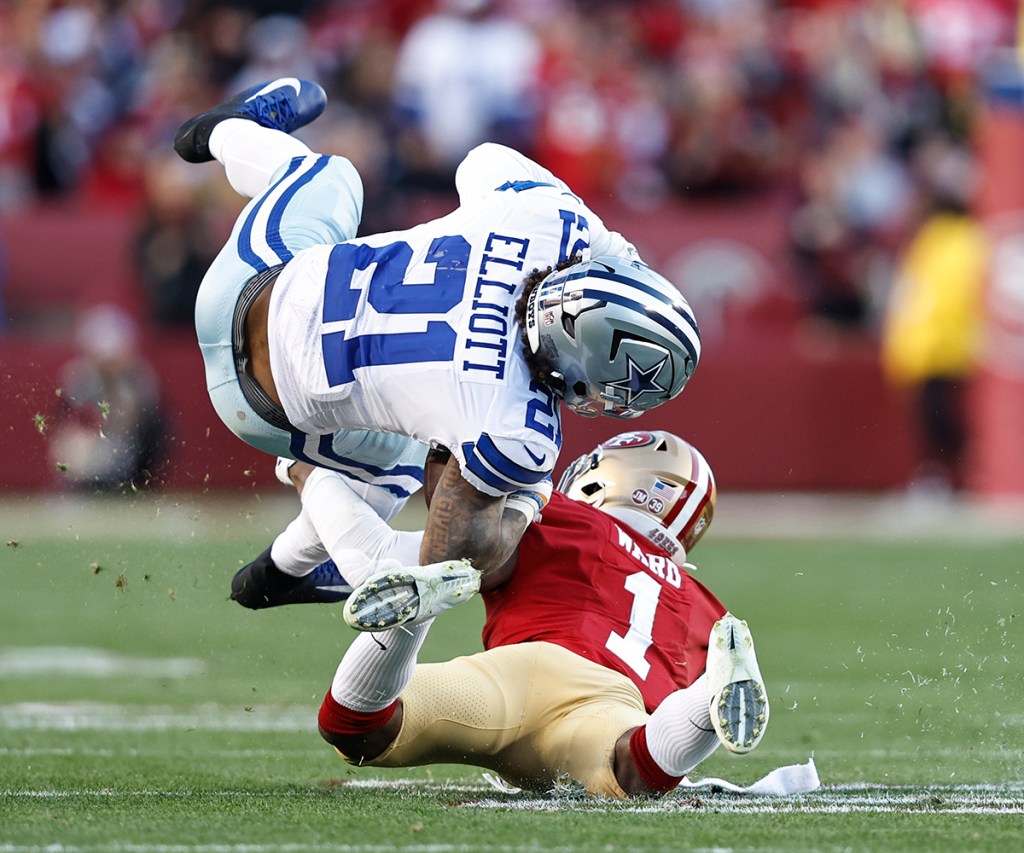 Cowboys running back Ezekiel Elliott is tackled by Jimmie Ward #1 of the San Francisco 49ers during the divisional round playoff game at Levi's Stadium on Jan. 22, 2023 in Santa Clara, California. 