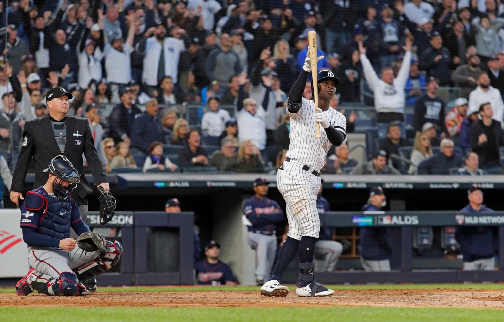 Yankees shortstop Didi Gregorius #18, standing at home plate, reacting, after hitting a grand slam 