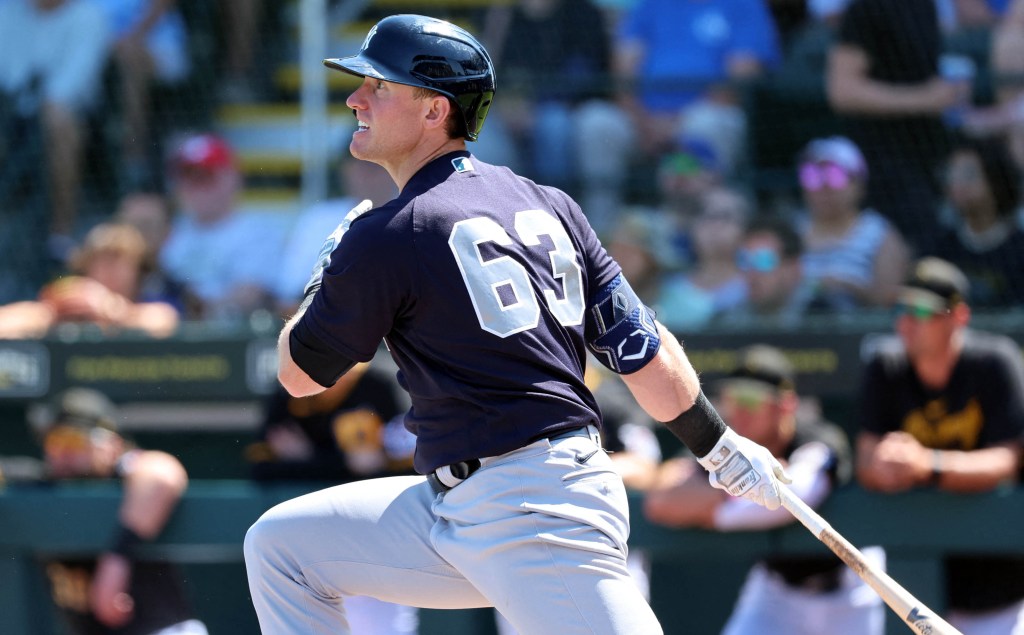 Billy McKinney hits a single during Yankees' spring training.