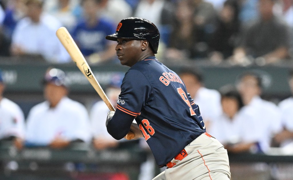 Didi Gregorius #18 of Team Netherlands hits a RBI single at the top of the first inning during the World Baseball Classic