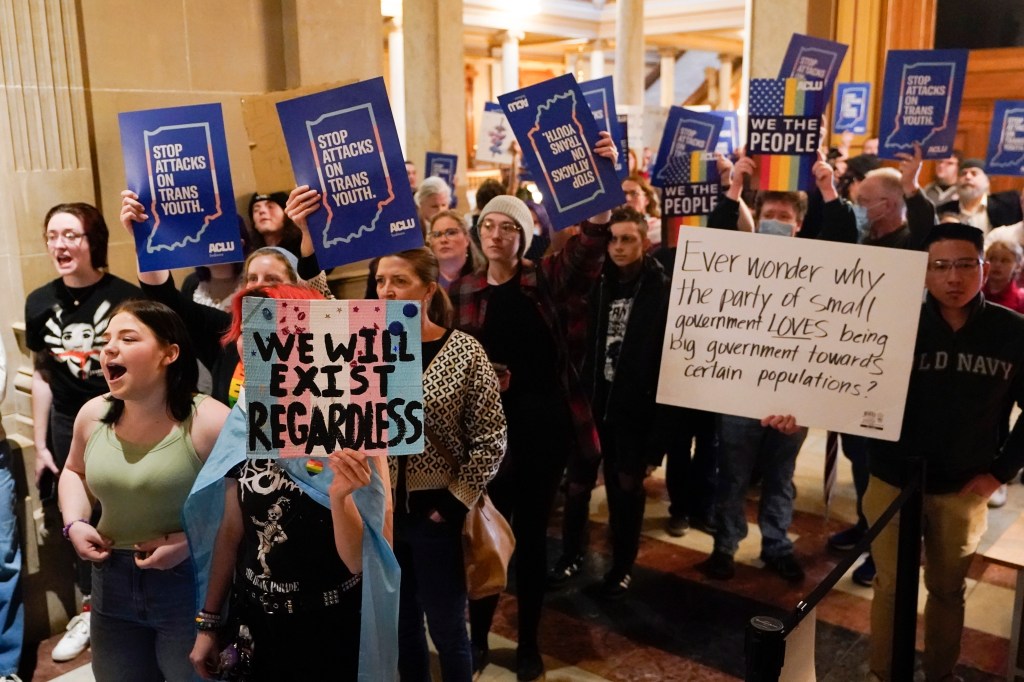 Protesters stand outside of the Senate chamber at the Indiana Statehouse on Feb. 22, 2023, in Indianapolis. 