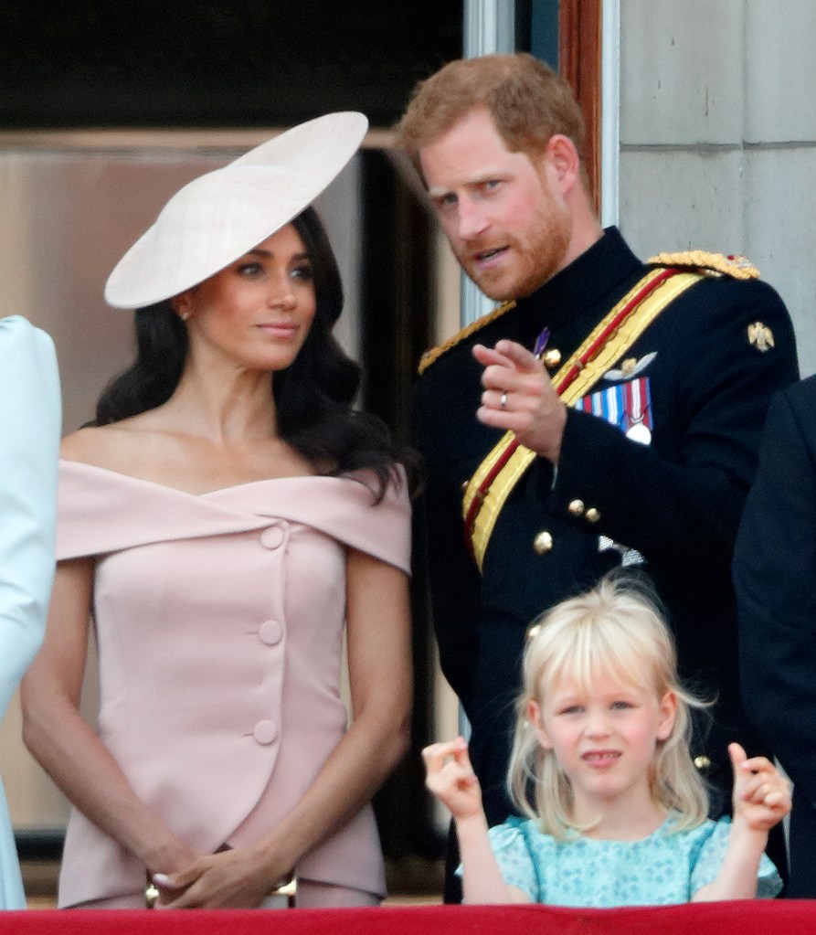 Prince Harry and Meghan Markle stand on the balcony of Buckingham Palace during Trooping The Colour 2018.