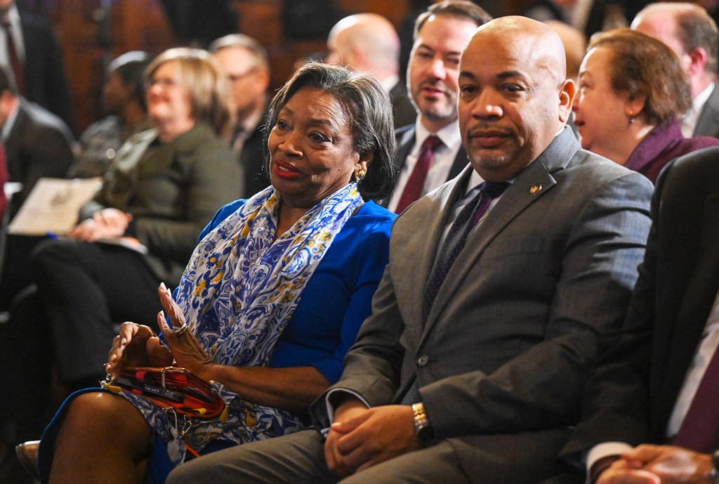 Carl Heastie photo on one side with Kathy Hochul on the other