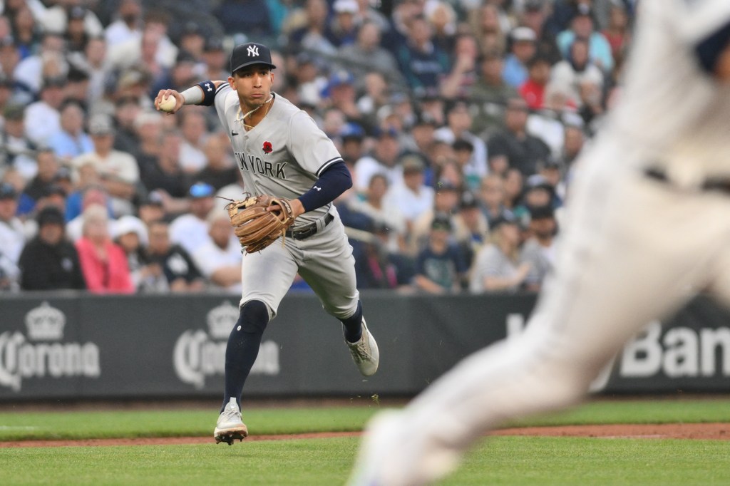 Yankees third baseman Oswaldo Cabrera throws to first against the Mariners on May 29, 2023.