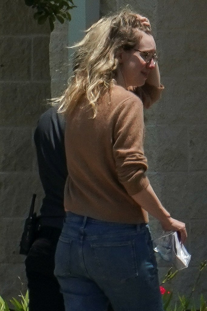 Theranos founder Elizabeth Holmes arrives to begin serving her prison sentence for defrauding investors in the failed blood-testing startup, at the Federal Prison Camp in Bryan, Texas, U.S. May 30, 2023. REUTERS/Go Nakamura