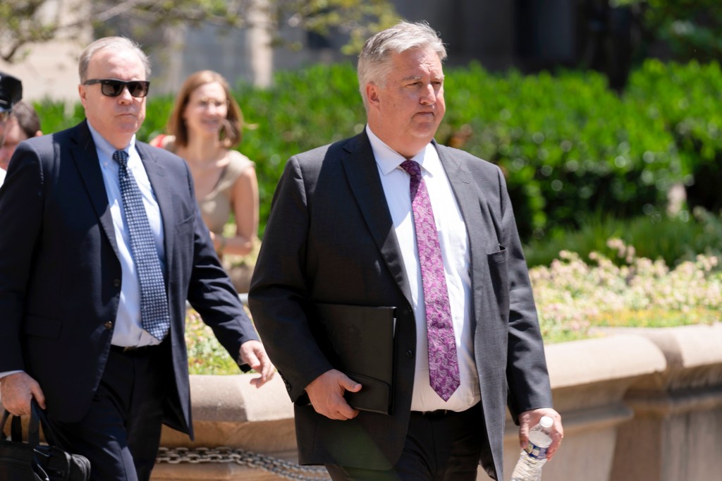 Trump's attorneys James Trusty, right, and John Rowley, left, leaving a meeting with the DOJ on June 5, 2023.