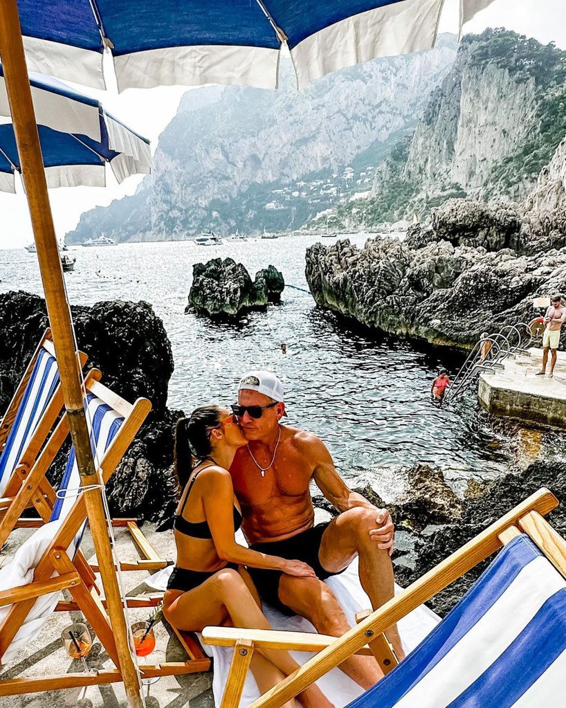 In a PDA-packed photo, Aikman and his new flame, show off their toned physiques in Italy.