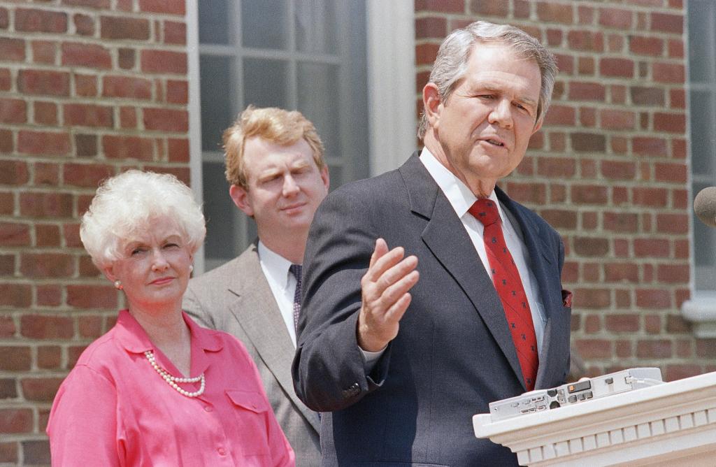 Pat Robertson during a news conference on May 16, 1988, at his home in Virginia Beach, Va, with his son Tim and wife Dede.