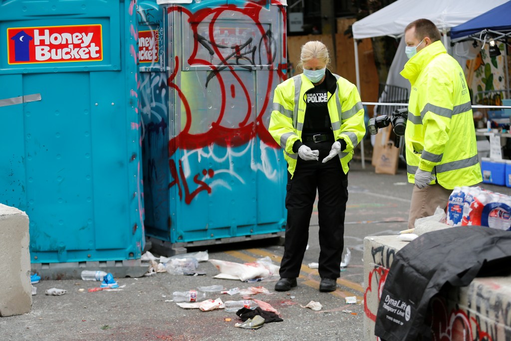 Police are pictured in the CHOP zone.