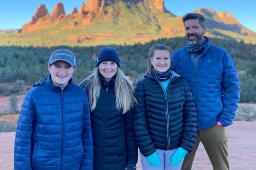 Sarah Crocker, 48 (2nd left), pictured with her husband, Brad, and their two children, Owen and Delaney