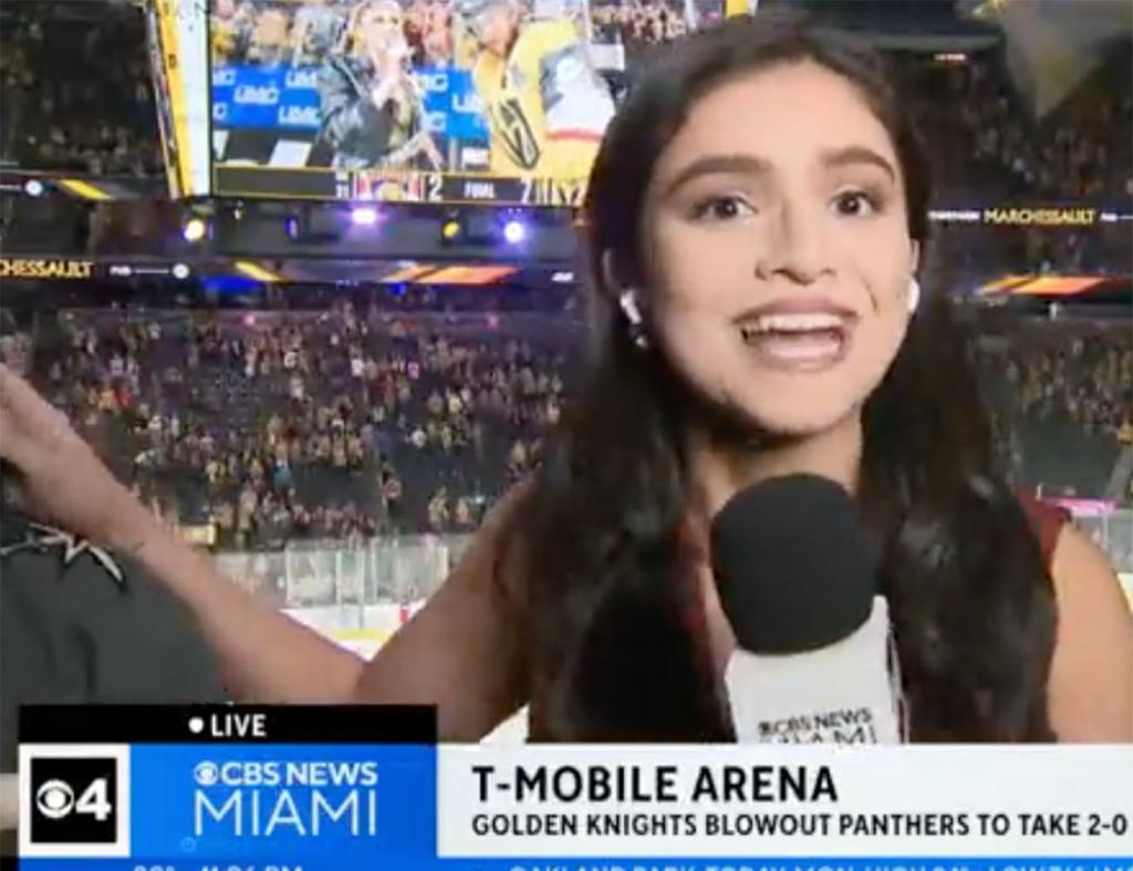 CBS Miami sports reporter Samantha Rivera fending off a fan that attempted to enter her live shot during a recap of Game 2 of the Stanley Cup Final on June 5, 2023.