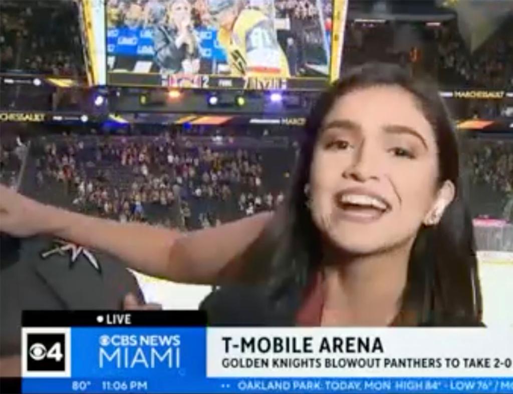 CBS Miami sports reporter Samantha Rivera fending off a fan that attempted to enter her live shot during a recap of Game 2 of the Stanley Cup Final on June 5, 2023.