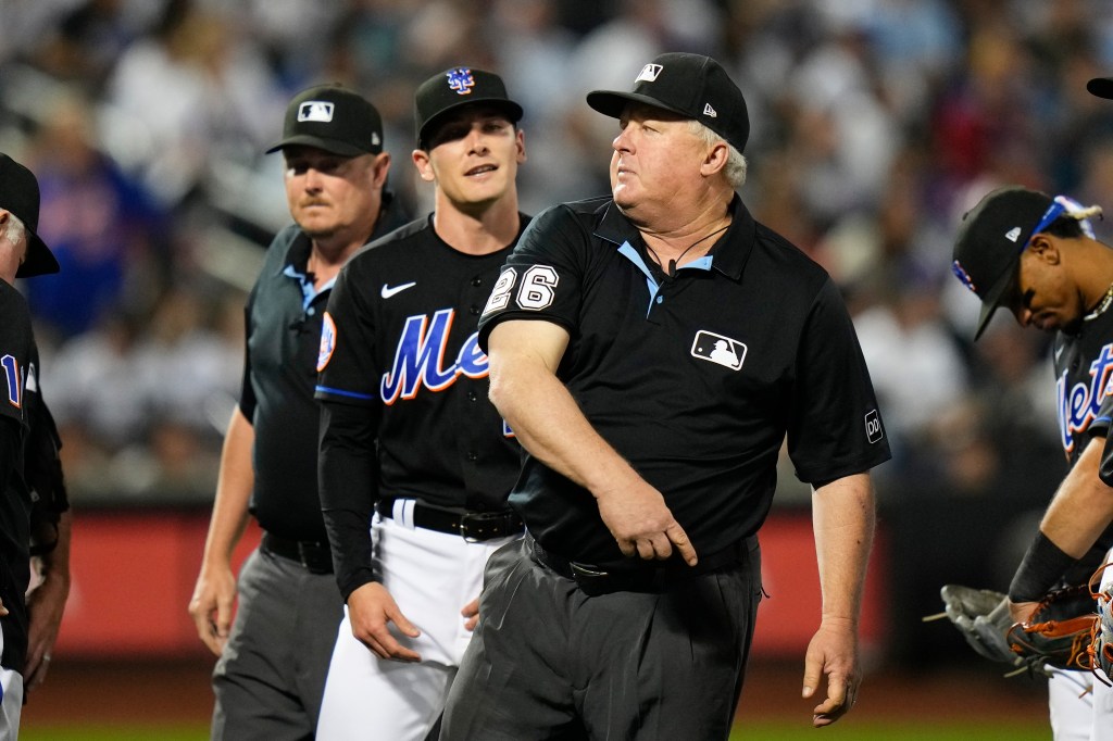 Umpire Bill Miller, right, ejects New York Mets relief pitcher Drew Smith, center, during the seventh inning of a baseball game against the New York Yankees Tuesday, June 13, 2023