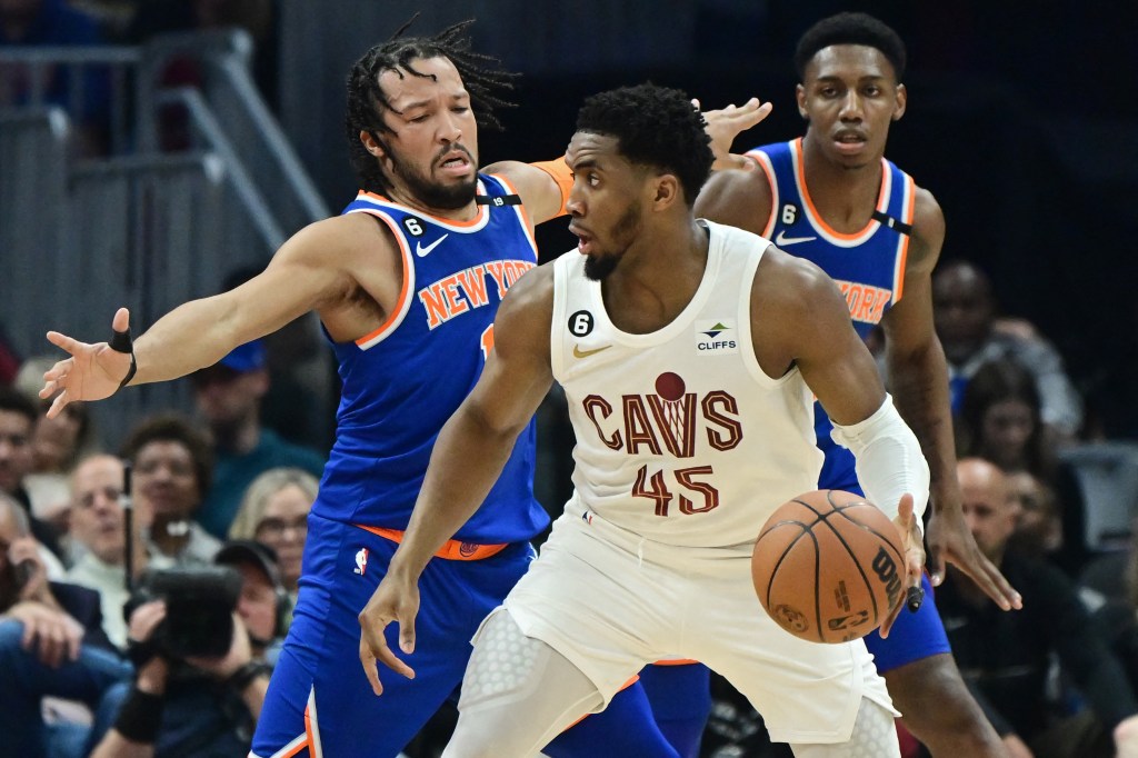 lCeveland Cavaliers guard Donovan Mitchell (45) is defended by New York Knicks guard Jalen Brunson (11) during the first half at Rocket Mortgage FieldHouse.