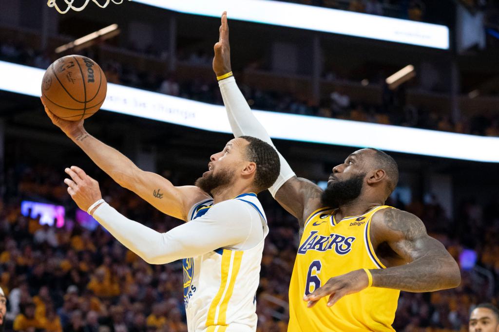 Stephen Curry shoots against LeBron James during the third quarter in game five of the 2023 NBA playoffs conference semifinals.