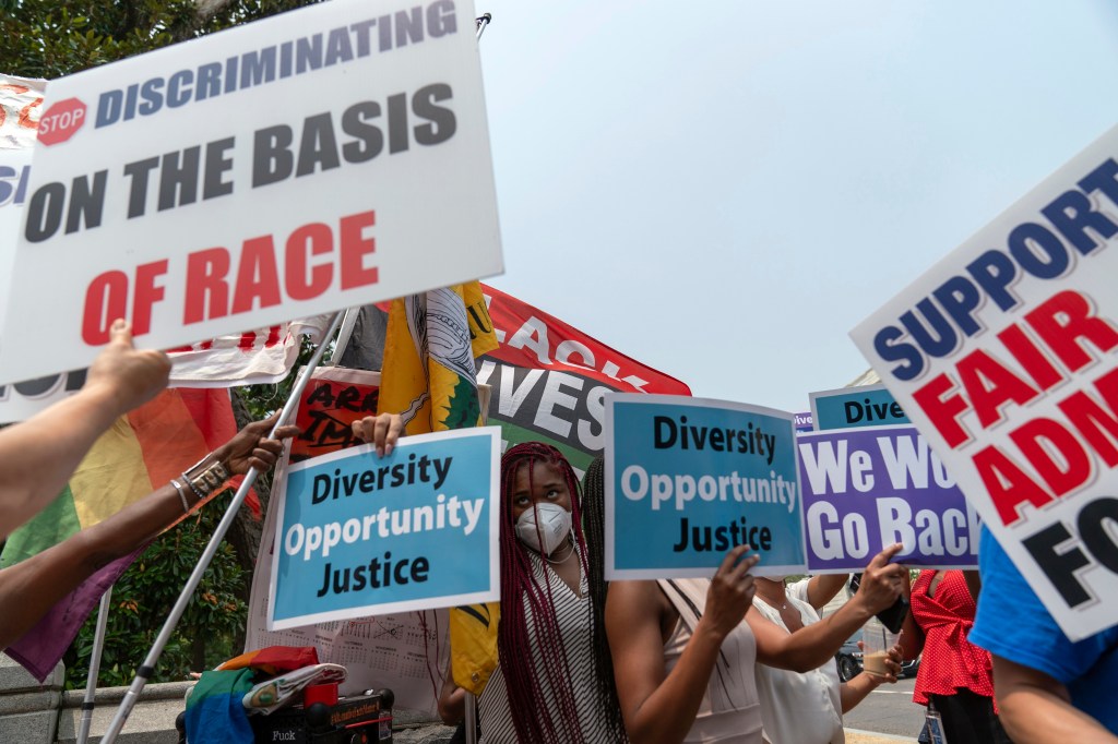 People demonstrating both for and against affirmative action after the court's ruling.