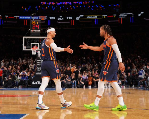 Josh Hart #3 and Jalen Brunson #11 of the New York Knicks high five during the game against the Utah Jazz on February 11, 2023 at Madison Square Garden in New York City, New York. 