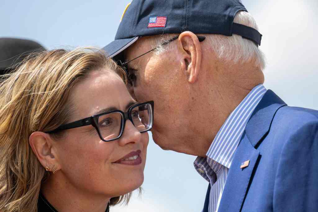 Sen. Kyrsten Sinema (I-Ariz.) and President Biden