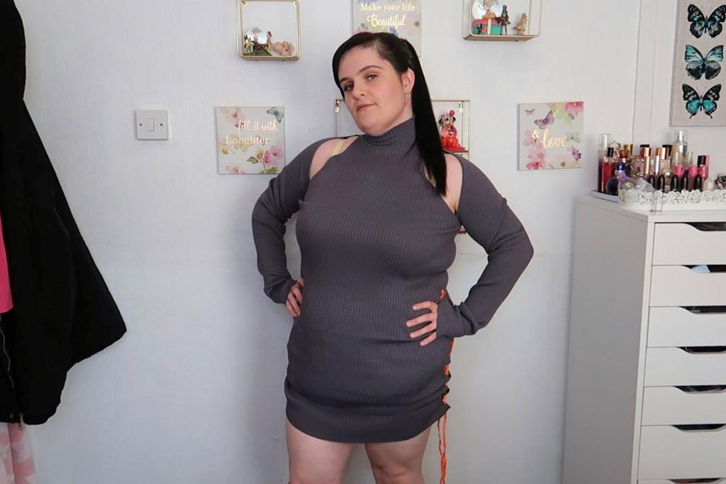 Photo of a woman wearing a gray dress. 