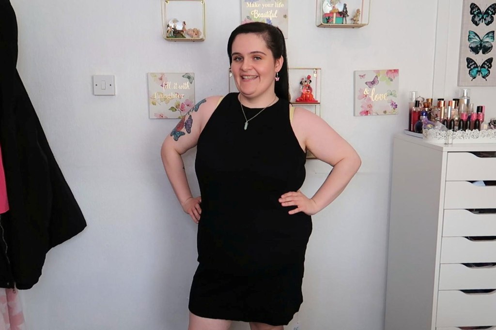 Photo of a woman wearing a black dress. 