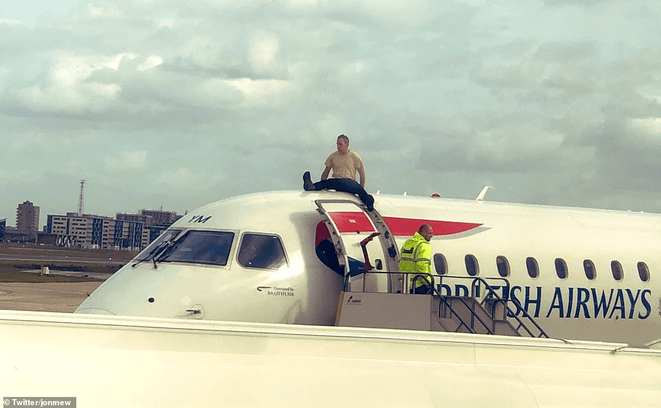 A man sitting on a plane