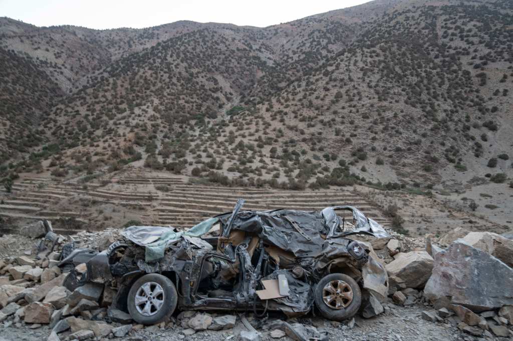 A car destroyed in the earthquake left on a road near Ijjoukak village.