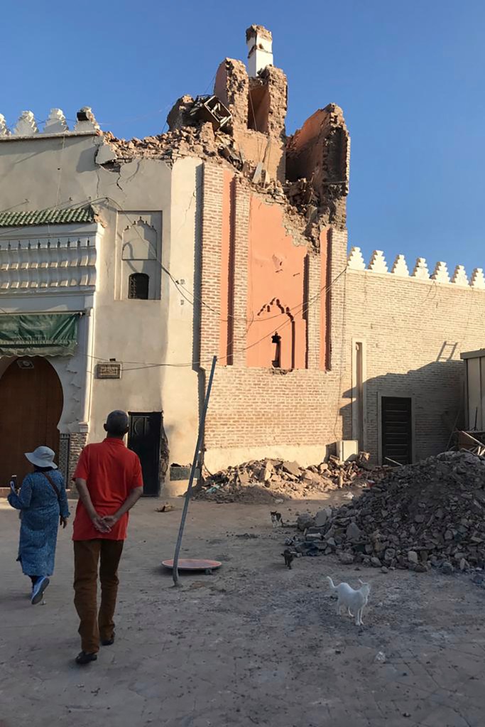 People inspecting damage in at Jamaa el Fna square in Marrakesh.