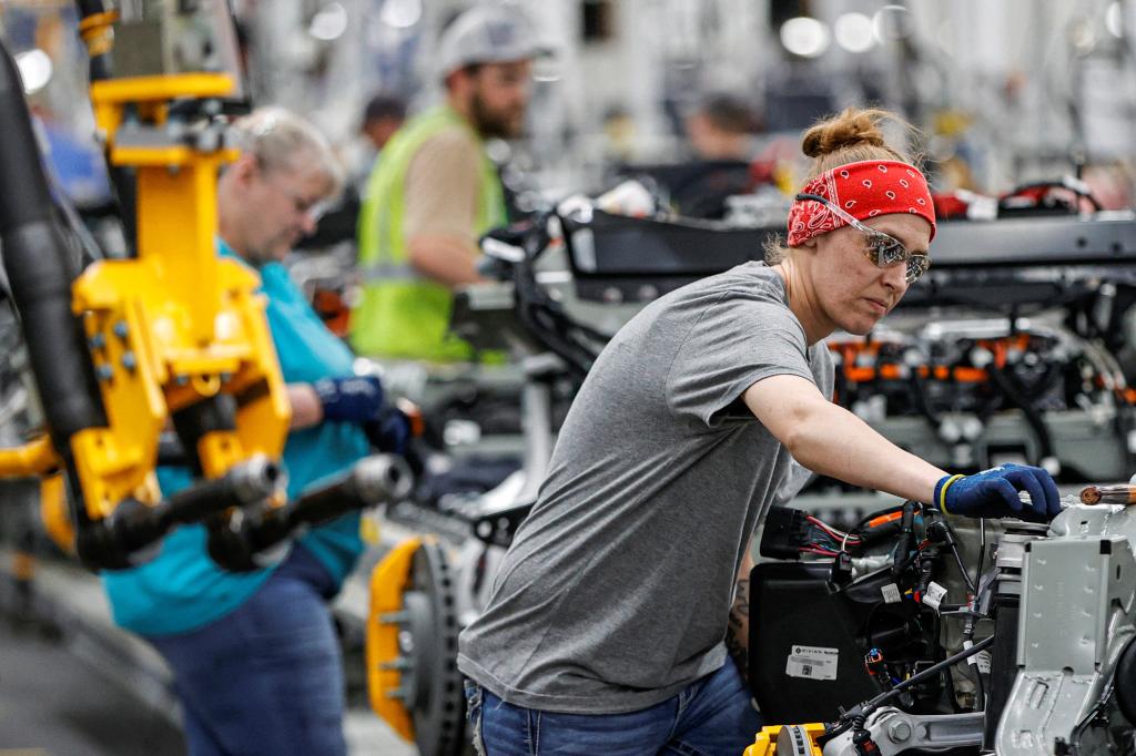 An employee working on the factor floor at Rivian, the e-car start-up. 