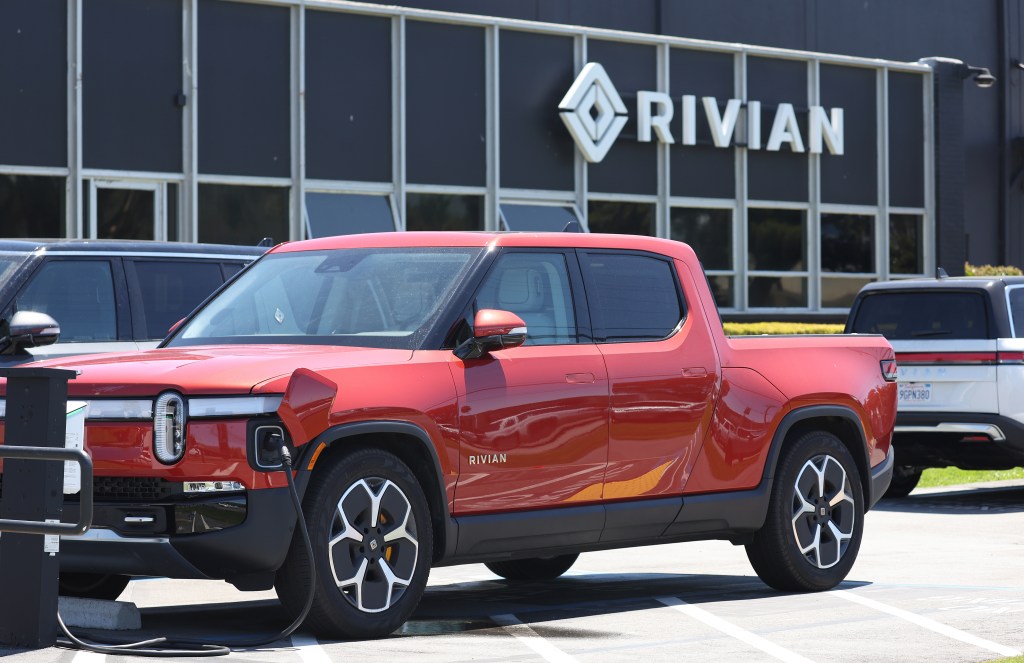 Electric vehicle-maker Rivian has halved its per-EV losses to around $33,000 each — less than half of what they were at the beginning of this year.