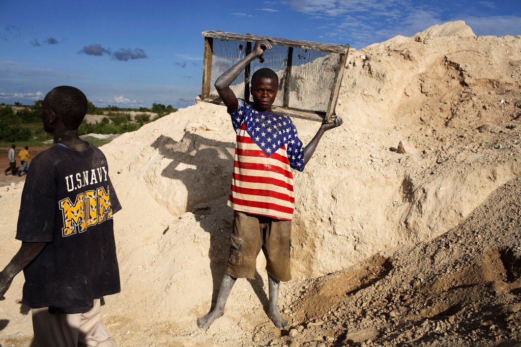 Children in the Democratic Republic of Congo mining copper and cobalt, rare and precious materials required for the manufacturing of electric batteries. 