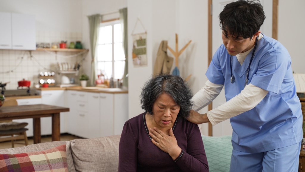 Photo of someone coughing. 