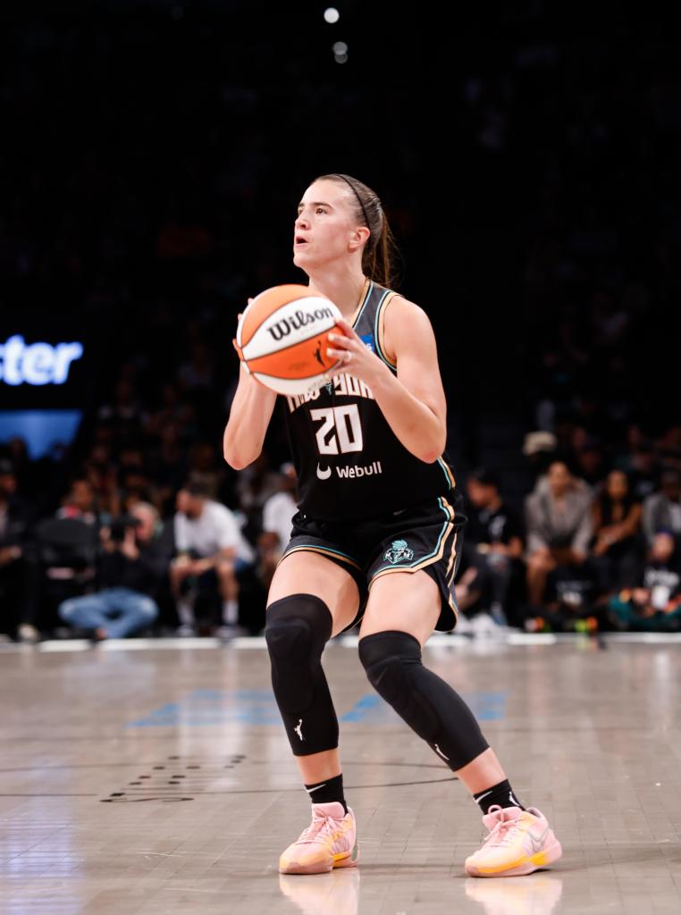 Sabrina Ionescu (20) of the New York Liberty makes a 3-pointer against the Washington Mystics on Sept. 10, 2023.