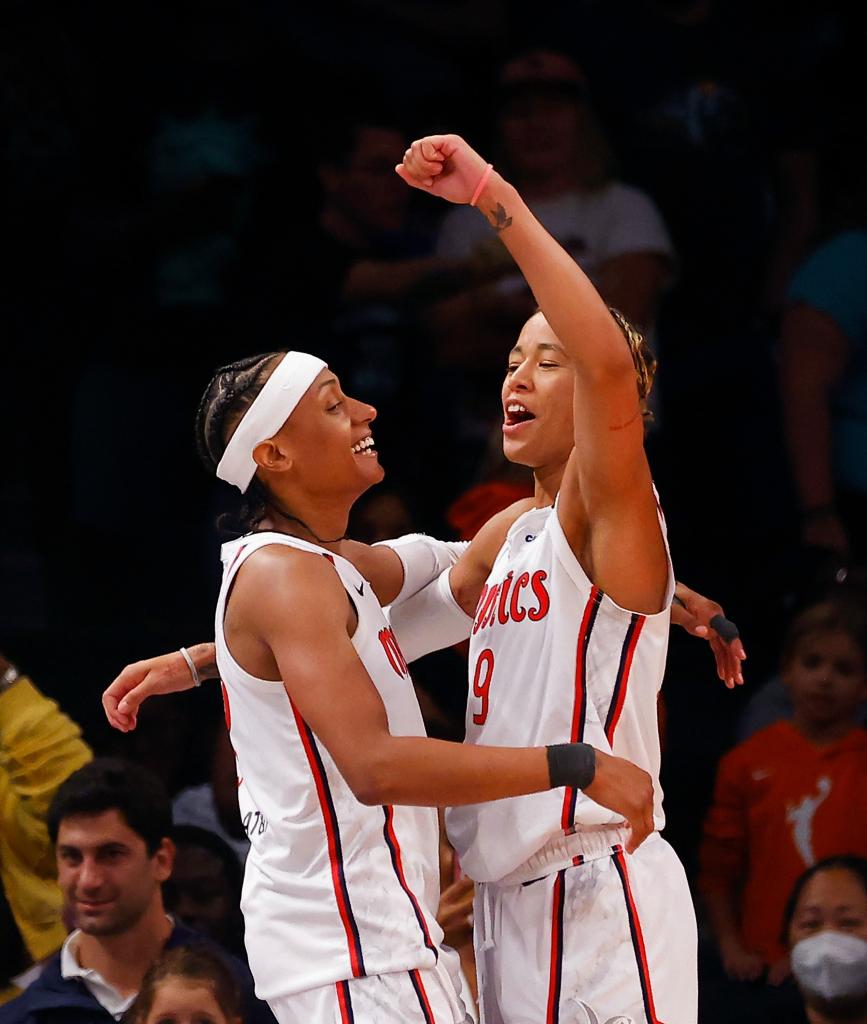 The Washington Mystics celebrate their 90-88 victory over the New York Liberty on Sept. 10, 2023.