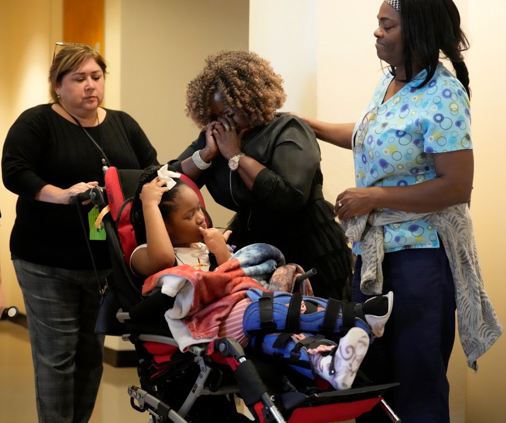 Clara Clark, center, with her granddaughter, Nevaeh Hall, 11, is comforted after being told to remove the child from the courtroom during closing arguments in the trial of Bethaniel Jefferson on Tuesday, Sept. 12, 2023, in Houston