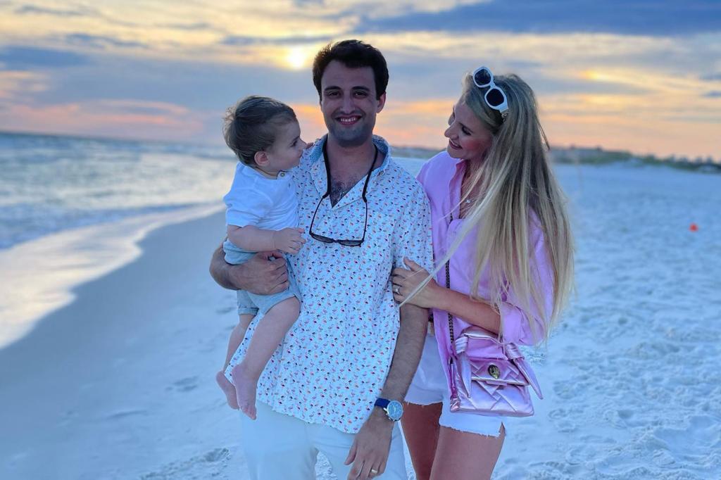 The Pollock family is pictured on a beach. 