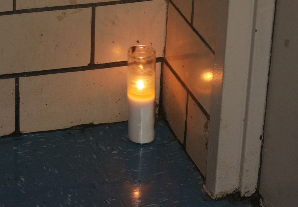 Candle left outside Rivera's apartment.