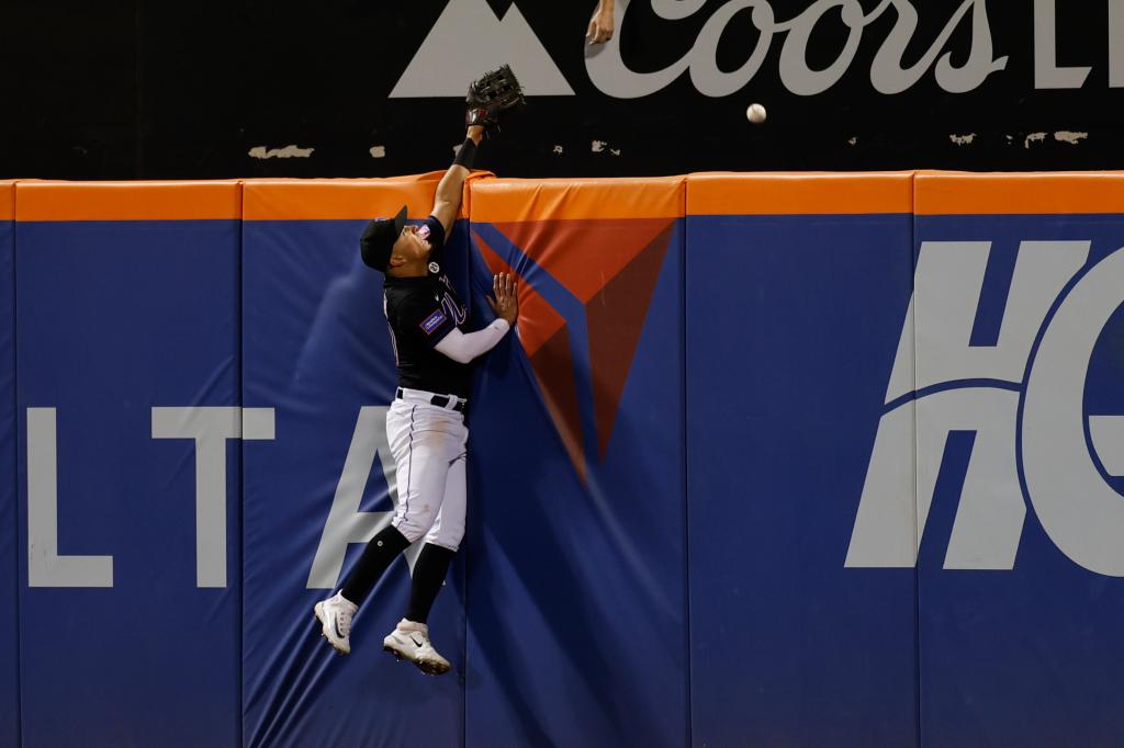 Rafael Ortega cannot field a two-run homer by Reds first baseman Spencer Steer in the sixth inning.