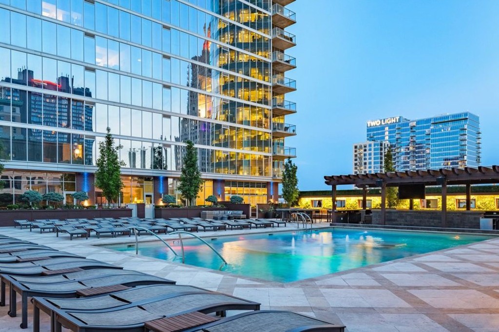 Amenities include a luxury rooftop pool, fireside lounges and a Onelife Fitness gym membership.