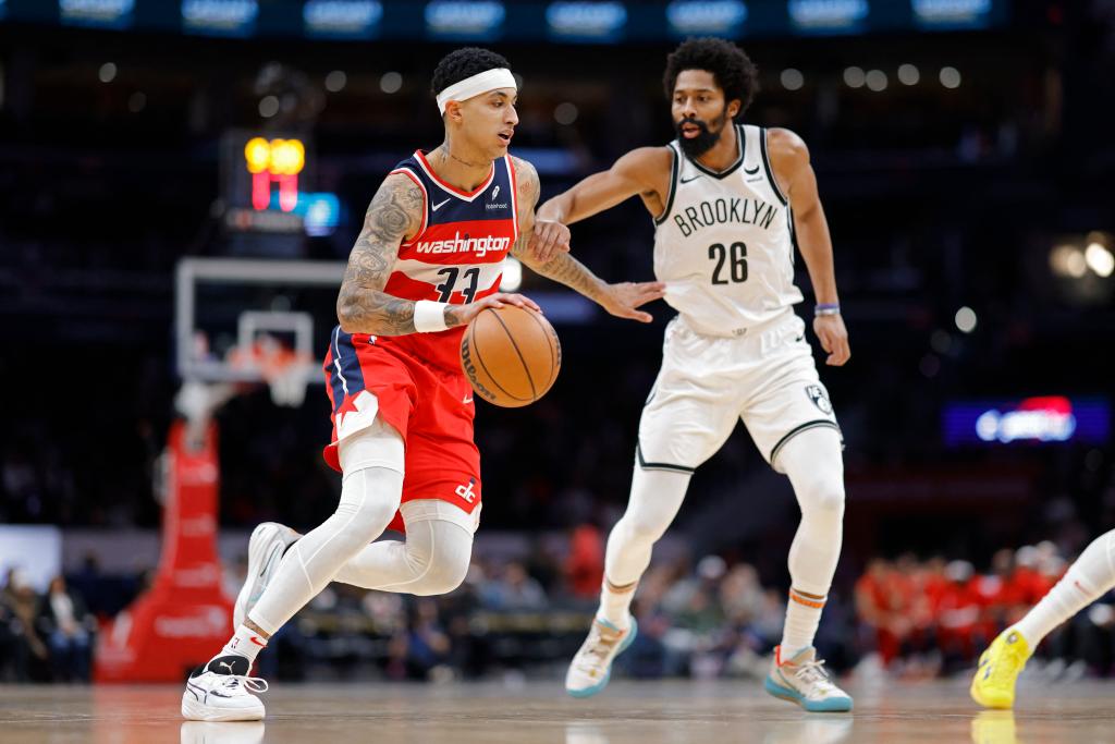 ashington Wizards forward Kyle Kuzma (33) drives to the basket as Brooklyn Nets guard Spencer Dinwiddie (26) defends.