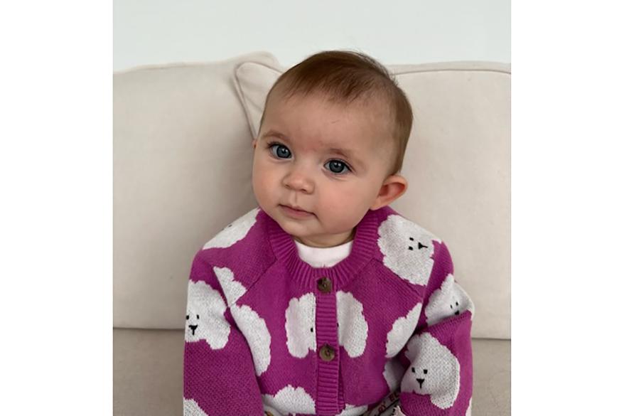 baby wearing cardigan from Tea Collection