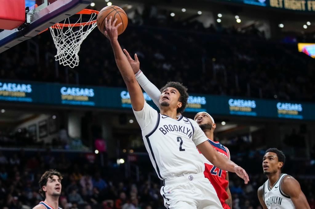 Cam Johnson (2) shoots in front of Washington Wizards center Daniel Gafford (21) during the first half.