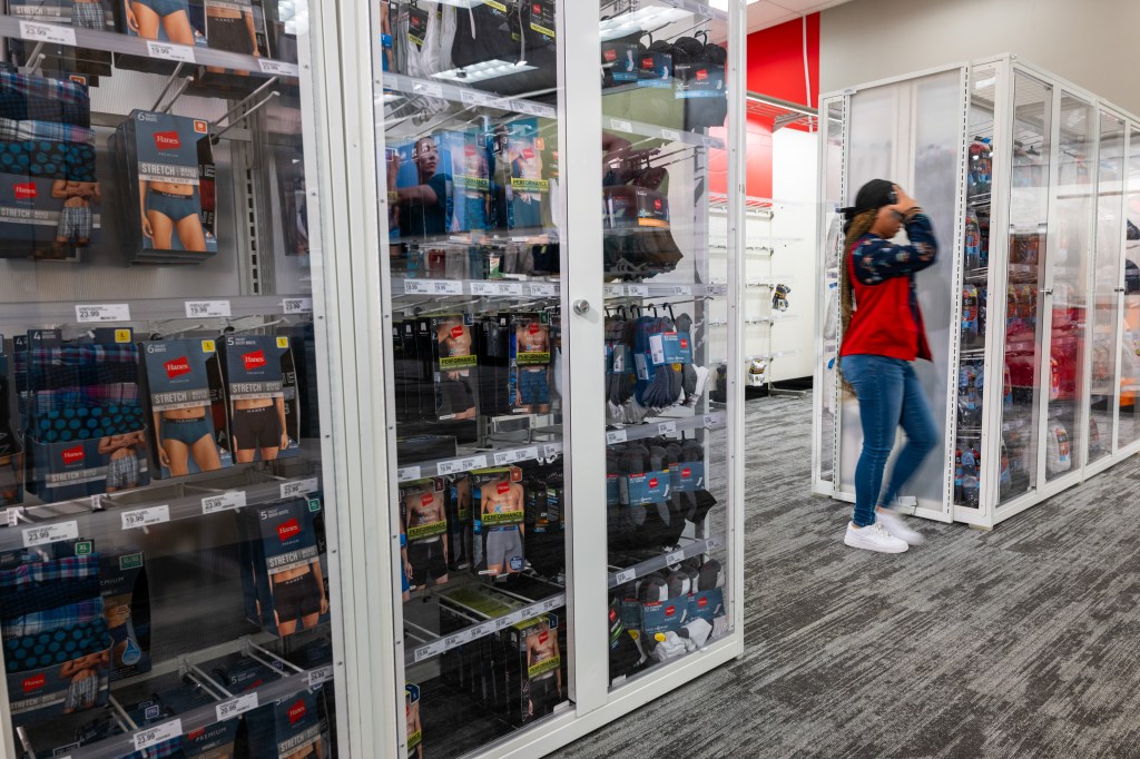 Men's underwear sits locked up behind plexiglass at a Target store in Harlem, Manhattan on Sept. 28, 2023.